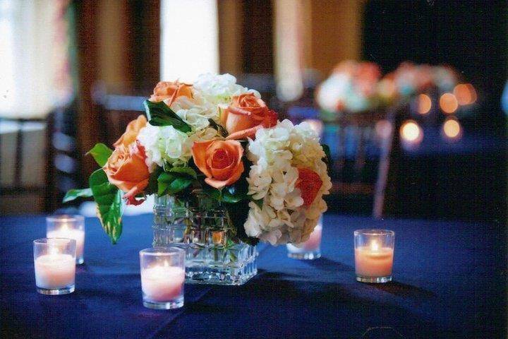 These centerpieces accented a navy blue and orange themed wedding.