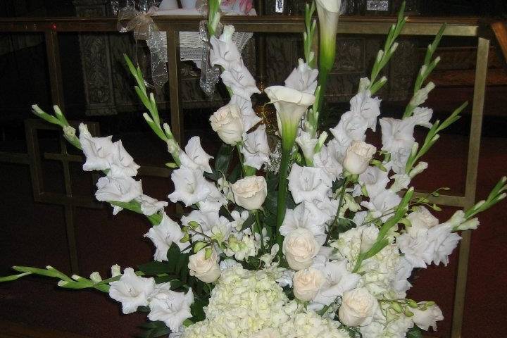 All white classic altar centerpieces for this traditional wedding.