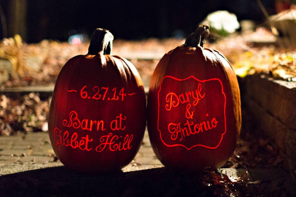 Lit pumpkins with the bride & groom's names, venue and date.