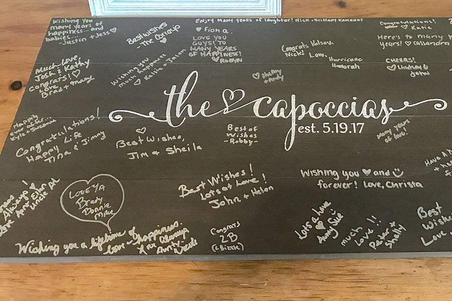 Wooden Guestbook sign, stained with white painted lettering for a wedding at Blissful Meadows in Uxbridge, Massachusetts