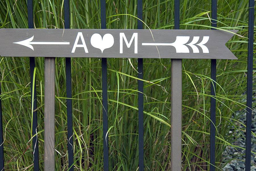 Hand painted directional sign in brown and white for a Cape Cod Wedding.