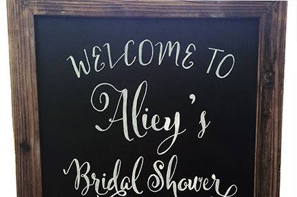 Custom Bridal Shower Chalkboard for a destination wedding in Nashville, Tennessee in a rustic wood frame with cowboy boots and a barrel.