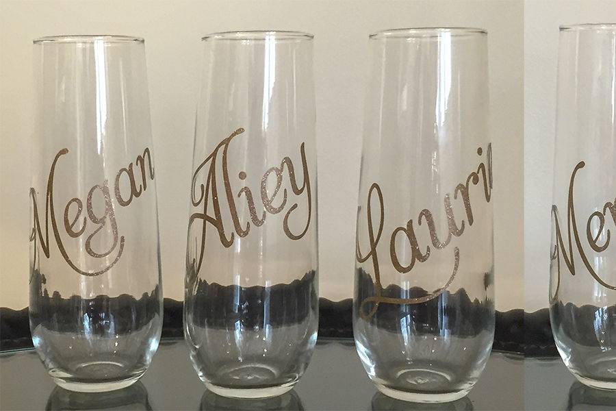 Personalized Stemless Champagne Flutes with gold glitter vinyl lettering for the bridesmaids and mothers.