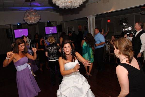 Bride and guests dancing