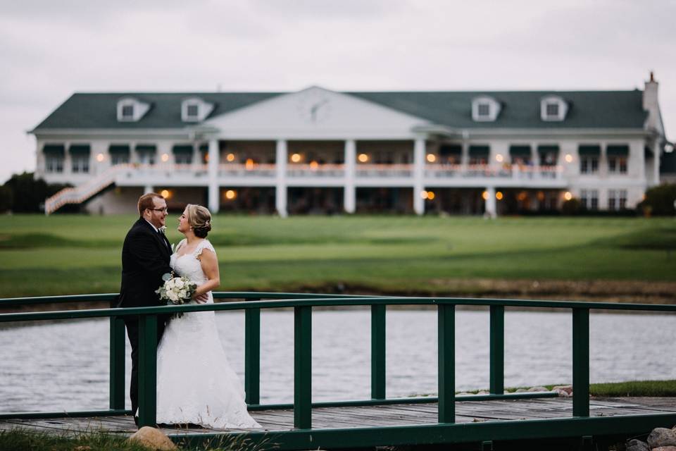 Bride, groom, and clubhouse