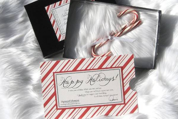 Boxed holiday mailer in red, white, and black.  Embellished with white faux fur, candy canes, and red and white ribbon.