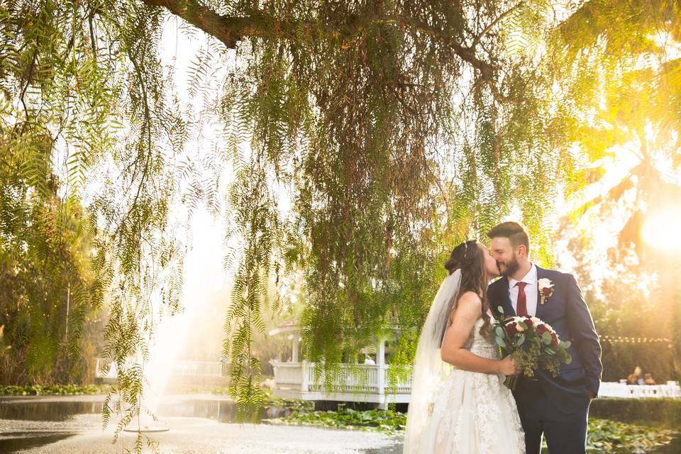 Couple posing before pond