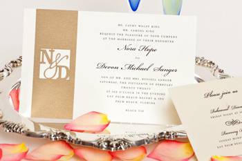 Wedding Style W-5002 is an elegant two layer invitation. What makes this design so special is the gold paper applique, which is further enhamced by the monogram laser cut through the paper.