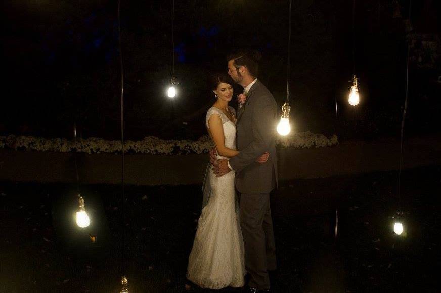Newlyweds under the lights | Mollie Wetta Photography Venue:  Botanica in Wichita