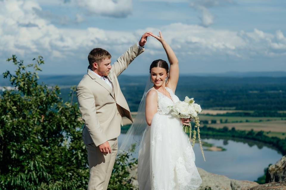 Groom twirling his Bride