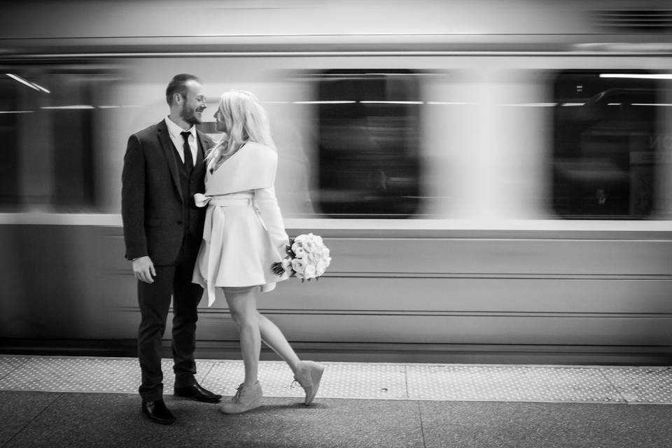 Couple posting in subway