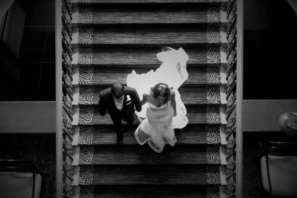 Newlyweds walking down stairs