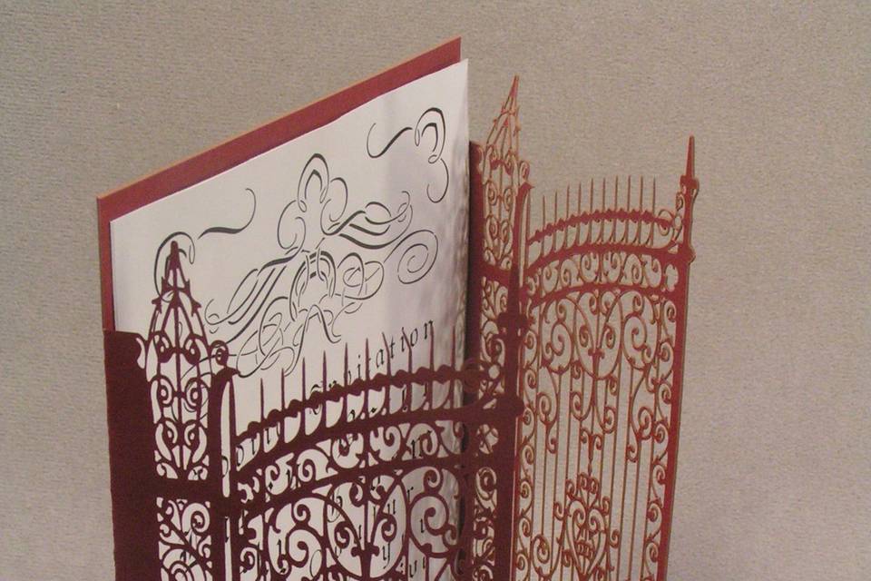 Gatefold for a wedding invitation. Intricate laser cut red paper