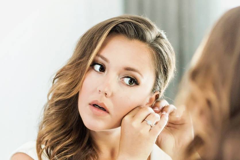 Putting on earrings