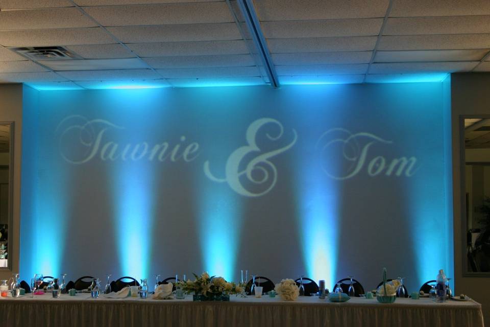 Monogram and up-lighting behind head table