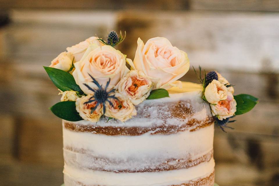 Naked wedding cake with flowers