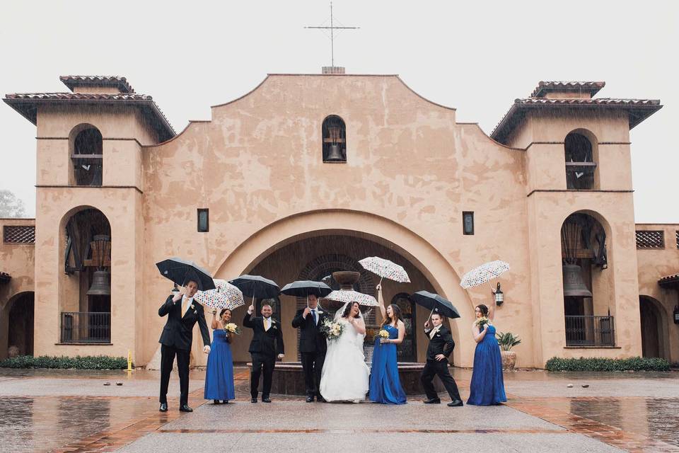 Wedding party out in the rain in Poway, California