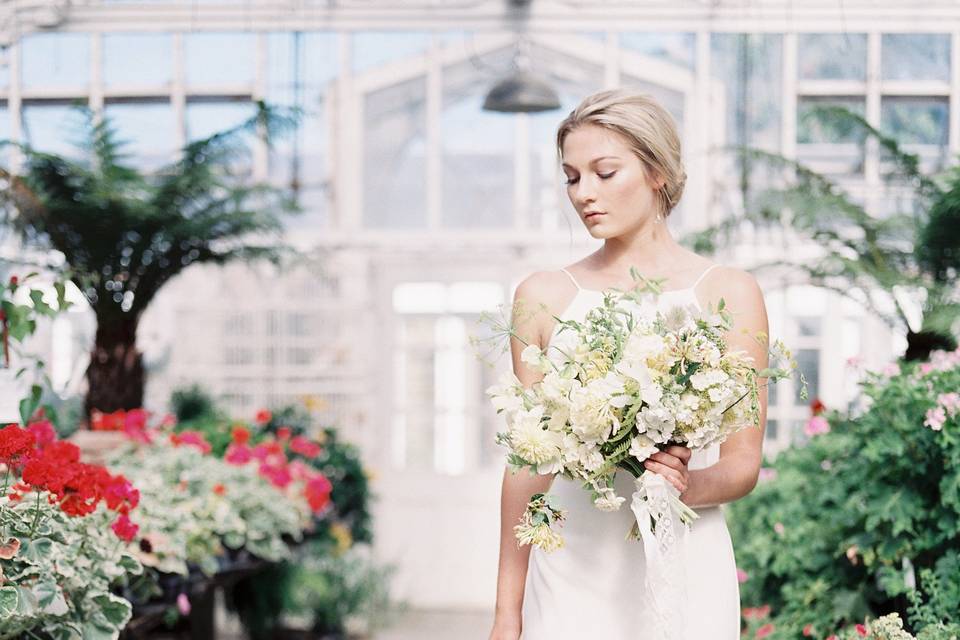 Laura Nichols Photography hangs a bride's dress on our vintage bridal cottage as if to say, 