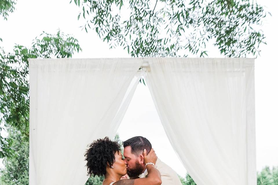 Newlyweds kissing - Crystal Artis Photography