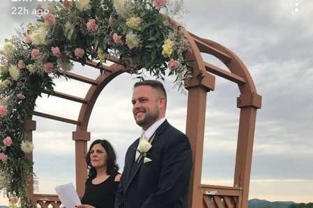 Rev. Susan & Drew watching the bride process