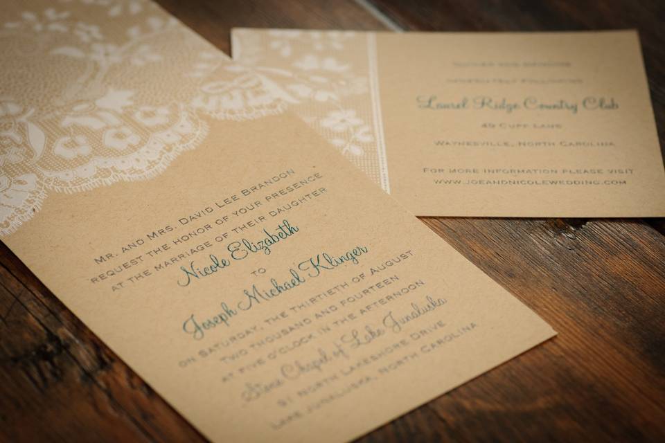 White details on tan invitation