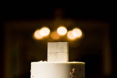 Dessert table with petit fours and a small cutting cake.