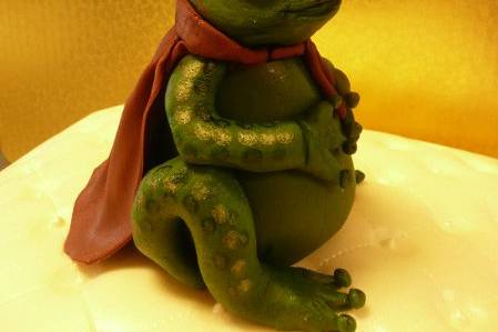 Topper for a pillow wedding cake. She kissed a lot of frogs before finding her prince!