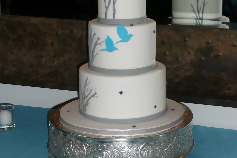 Sweet grey accented cake with blue birds