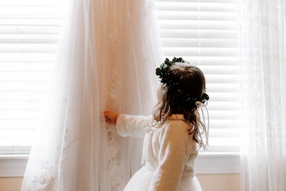 Flower child admires dress