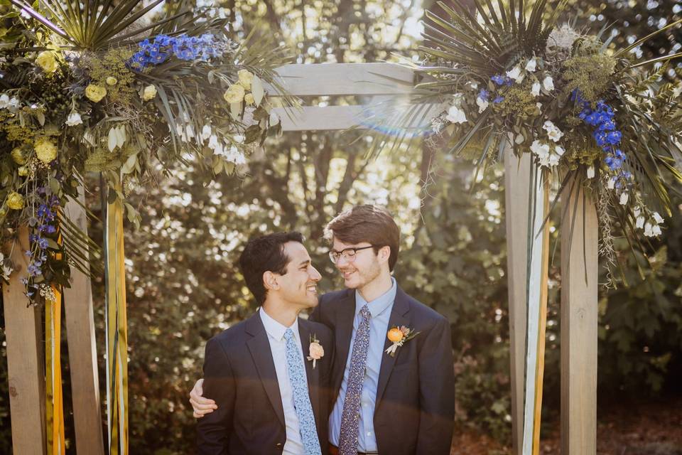 Vibrant blue ceremony florals