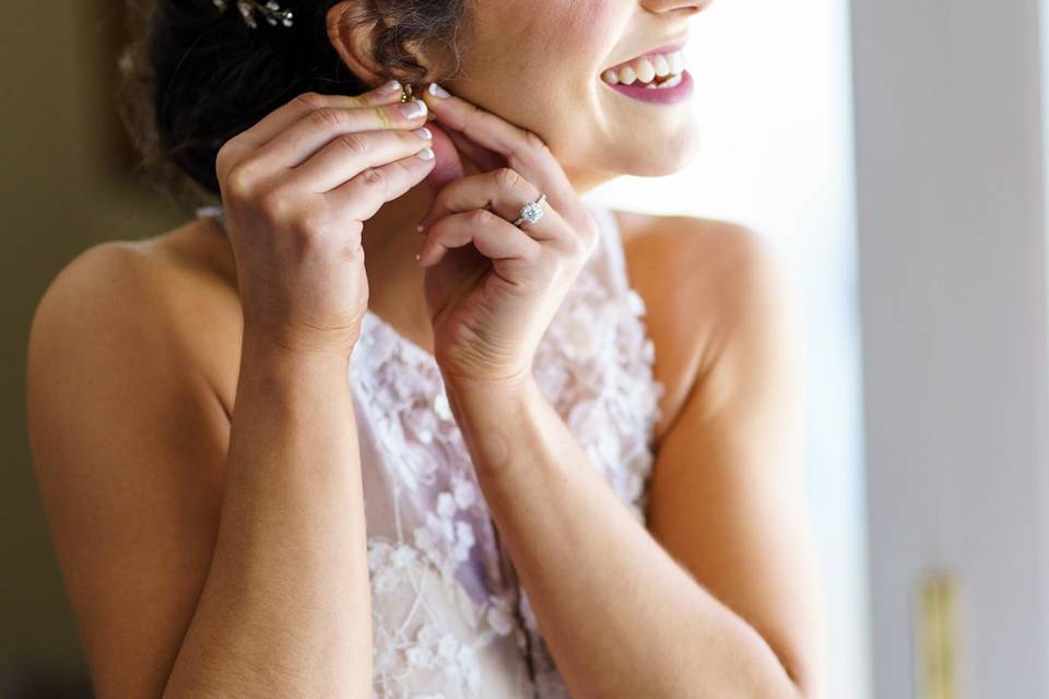 Putting on earrings