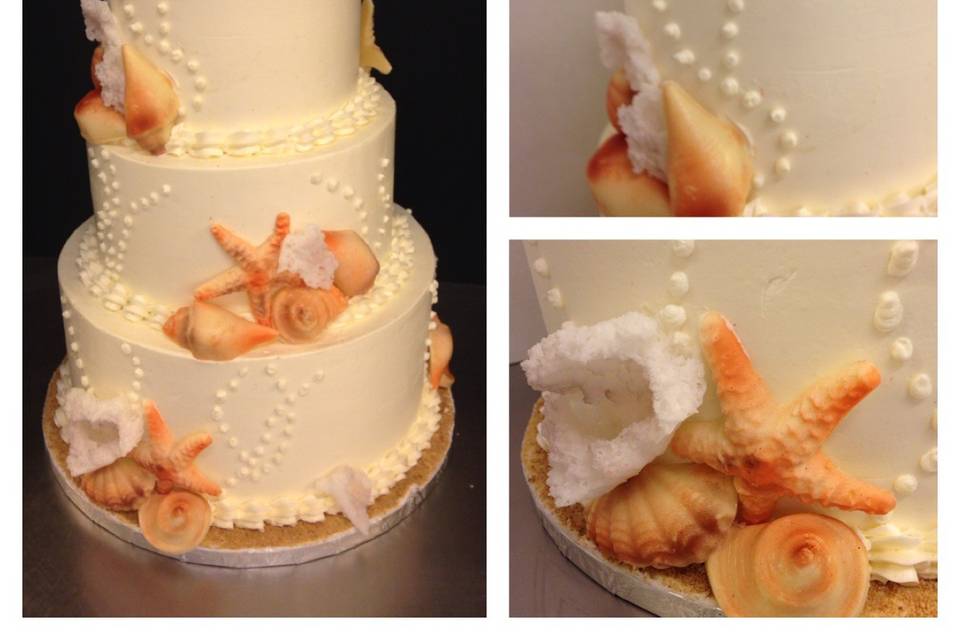 The sea shells on this cake are made from tempered white chocolate.
