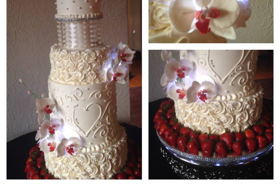 This cake is adorned with sugar chandelier beads, gumpaste orchids and illuminated with LED lights.