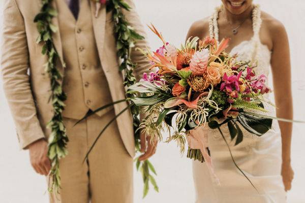 Couple with bouquet and plants