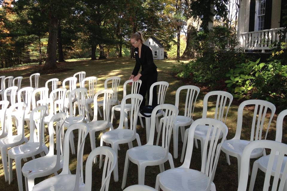 Planned 2 Perfection setting up the ceremony seating for 150 guests on the front lawn