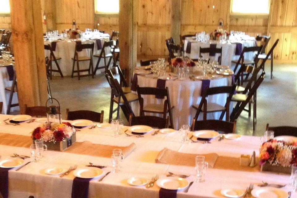 A large barn is the perfect spot for the wedding reception.