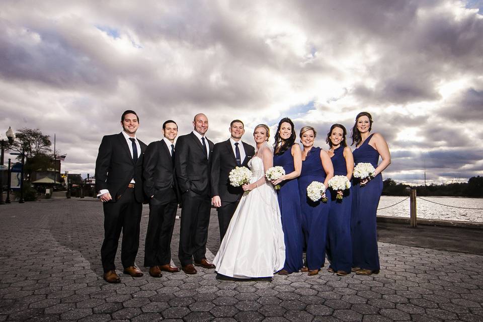 The couple with the bridesmaids and groomsmen