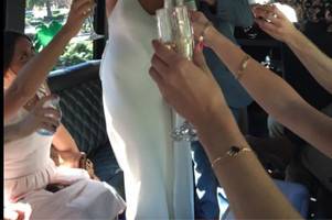 Bride toasting in New 2015 Party Bus in San Diego