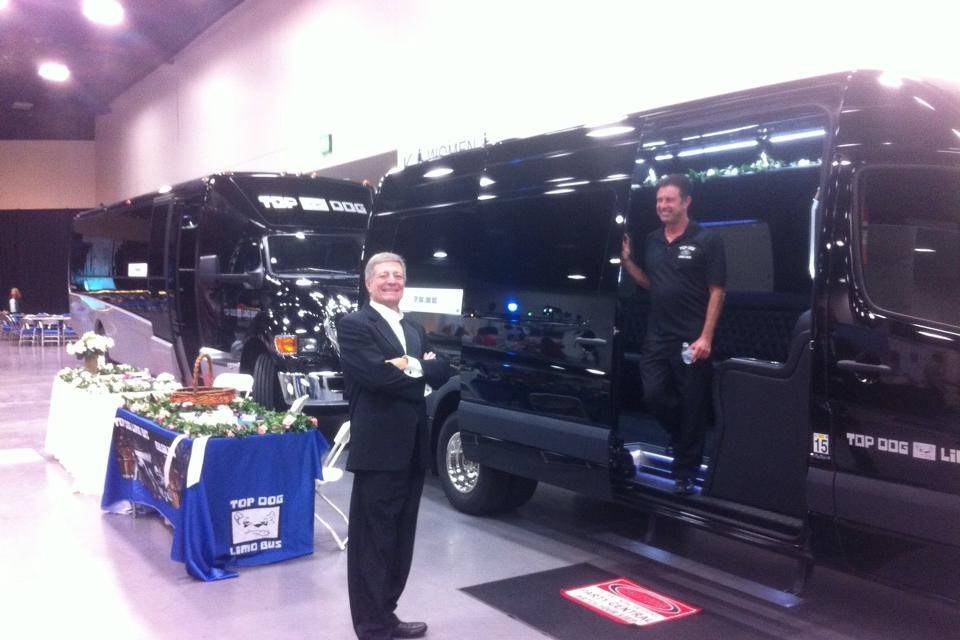 Russ in front of New 2015 Party Buses at the Bridal Bazaar in San Diego