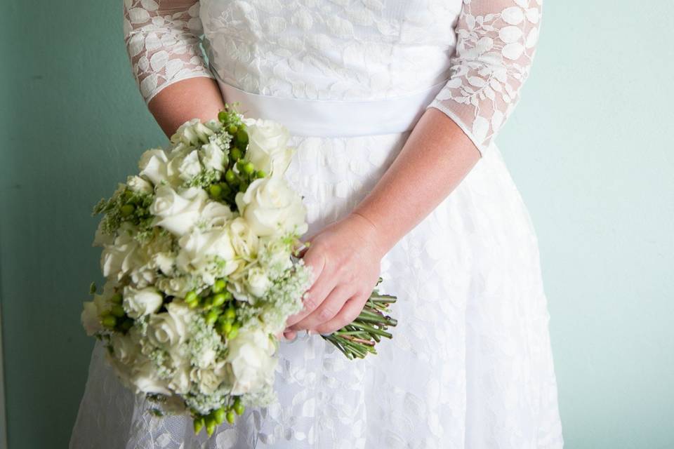 A beautiful, vintage style, tea length dress with a full petticoat, built-in bustier, and sash.