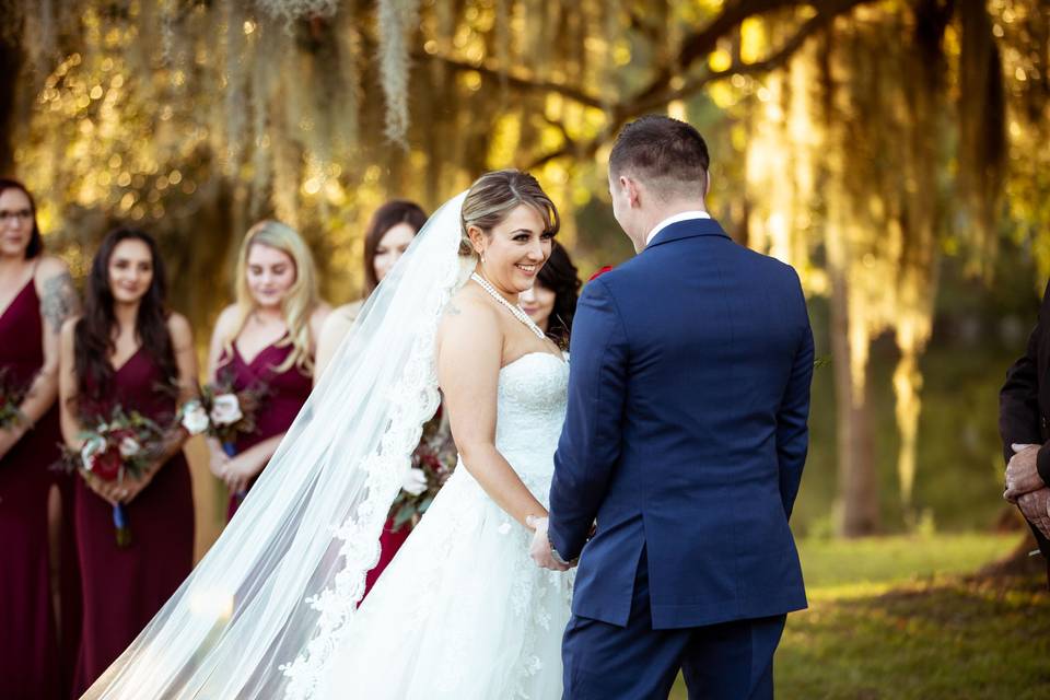 Couple during vows under Oak