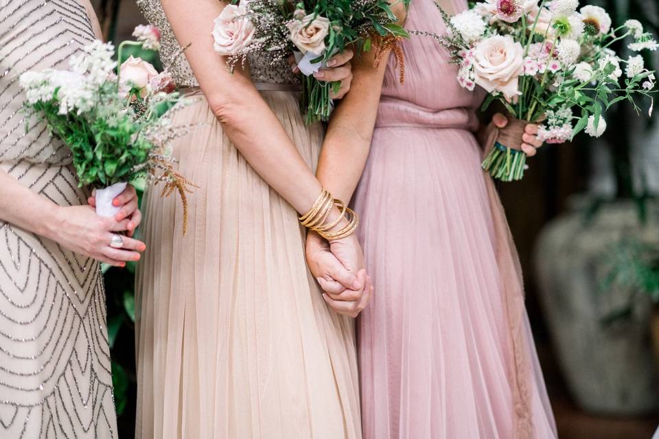 Bridesmaids holding each other