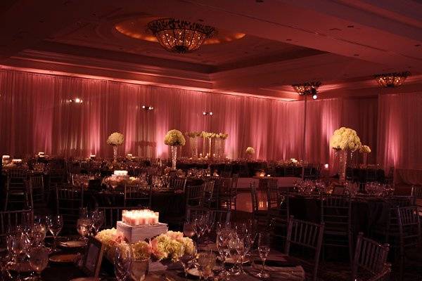A defined pattern on the dance floor surrounded by lush satin draping will captivate your guests.