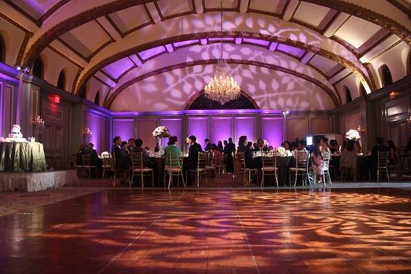 Foliage patterns on the wall and dance floor, with colored uplights to complement, will surely decorate an entire room.