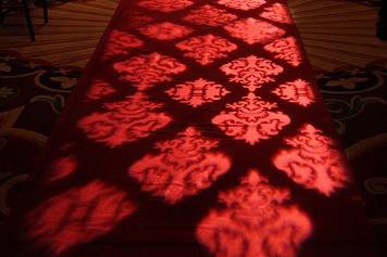 Damask Patterns projected on the aisle runner is a refreshing twist in giving your ceremony a contemporary look.