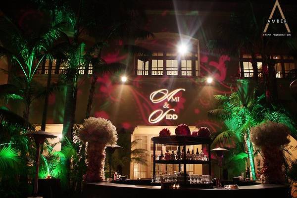 Outdoor garden setting with custom gobo, patterns on the wall and foliage washes