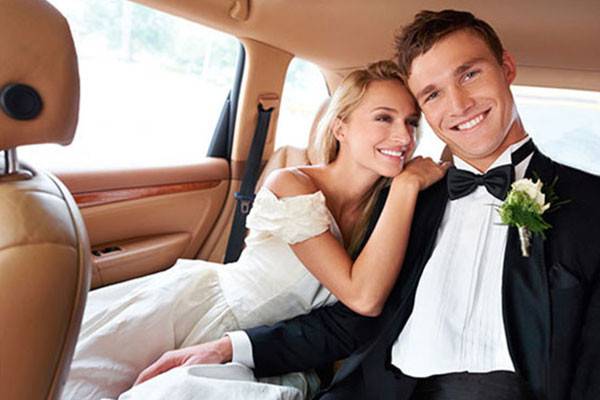 Newlyweds in a car