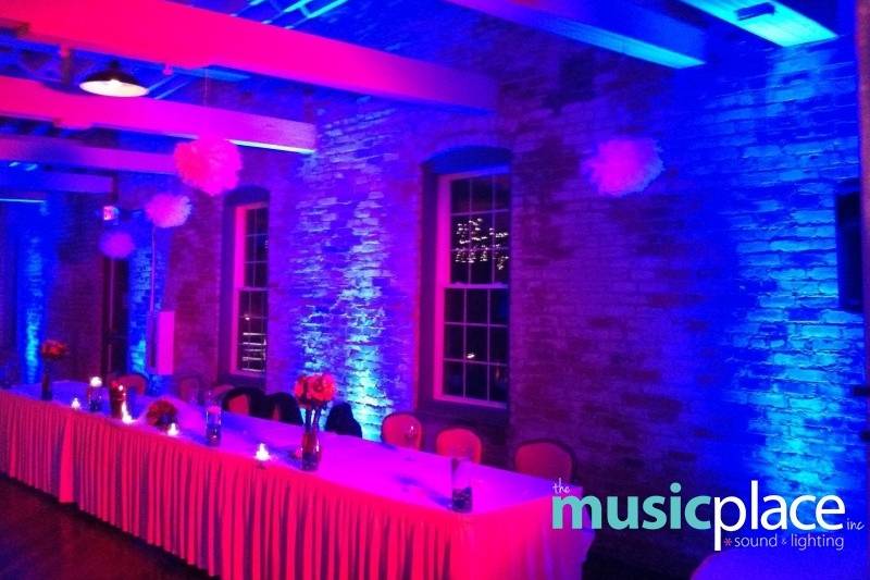 Purple uplighting and dance floor wash