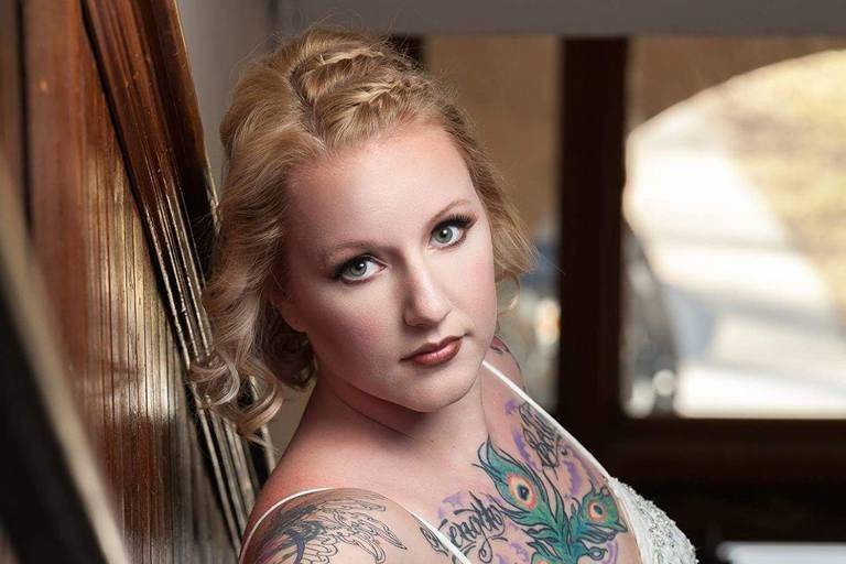 Bride posing by the staircase