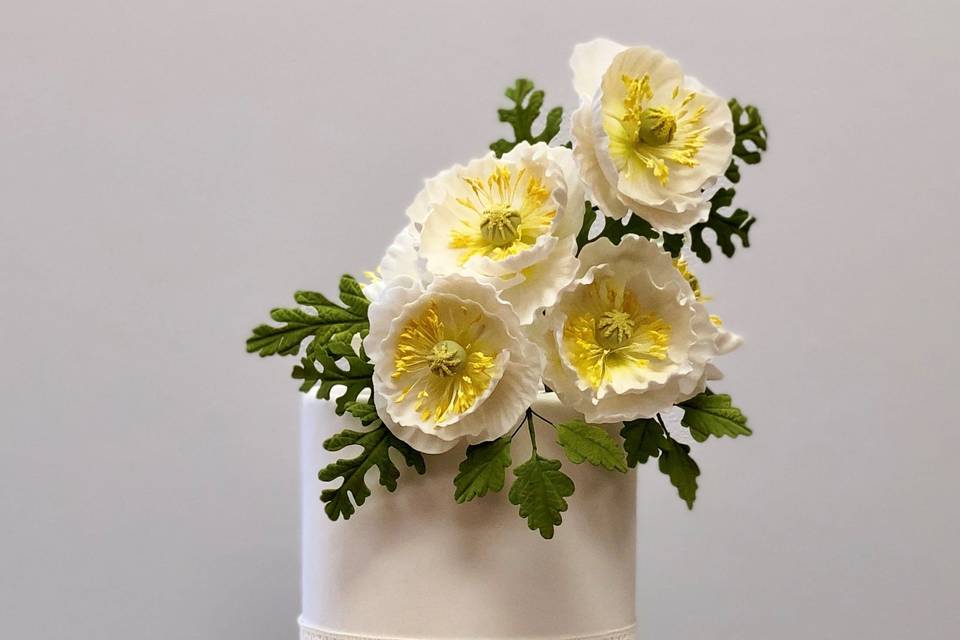 Three tier cake with flowers on top